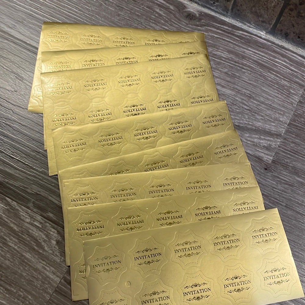 Brand new, set of 100 gold foil “invitation” envelope stickers